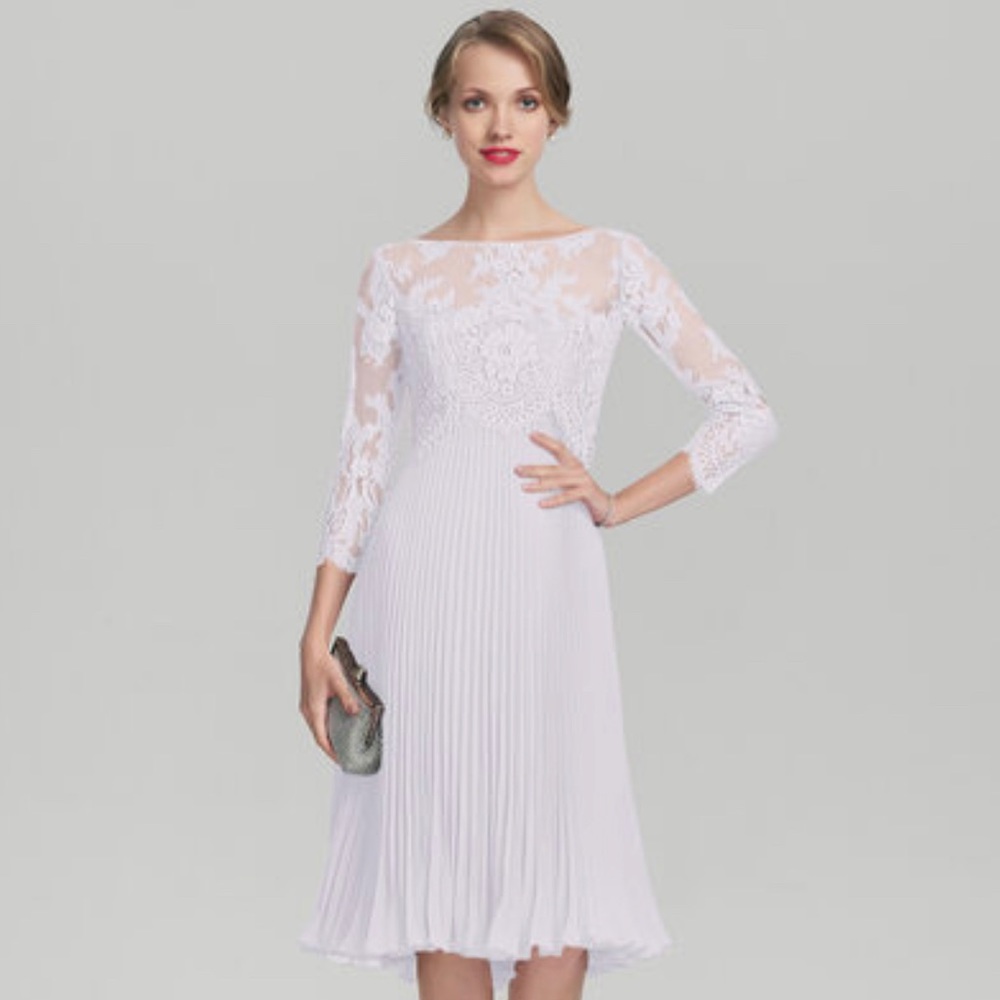 Pleated strapless wedding dress with lace cover